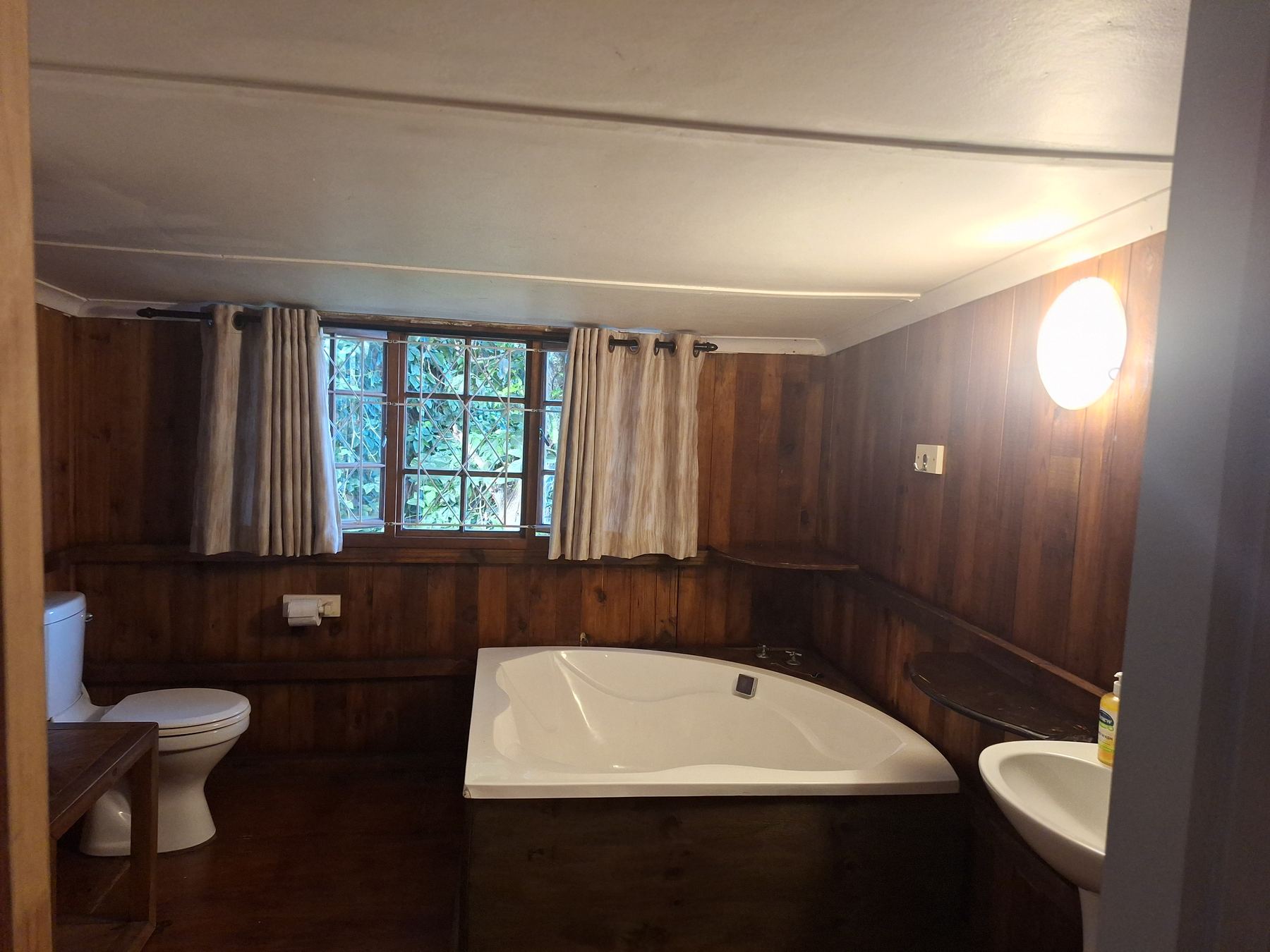 Bathroom with large corner bath